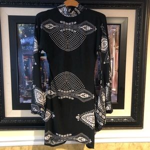 Black white design. Flair arms attached to dress